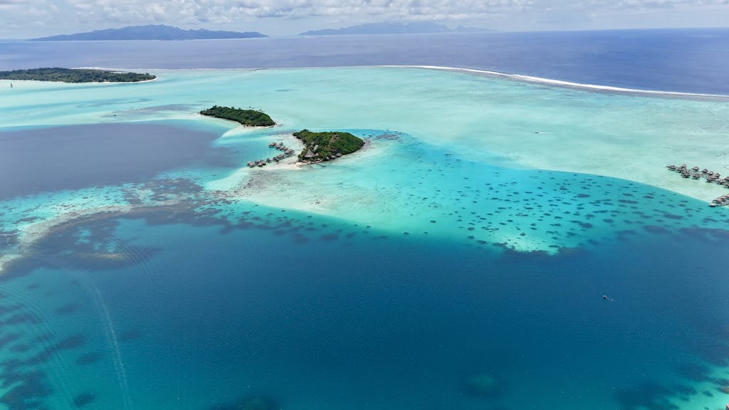 A breathtaking aerial view showcasing the turquoise waters and lush islands of Bora Bora.