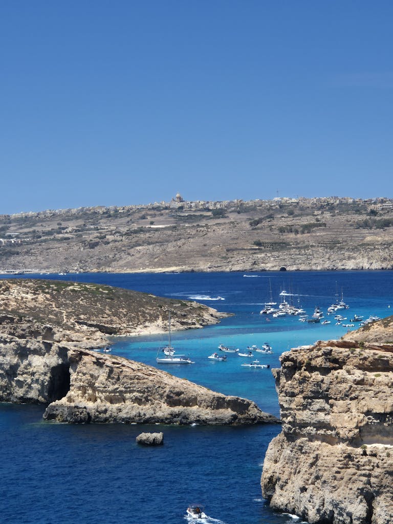 Aerial view of boats in the turquoise waters of Blue Lagoon, Malta.