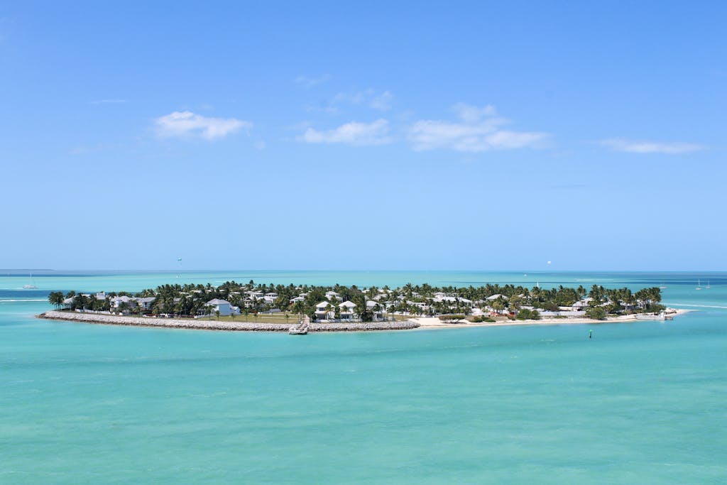 Scenic aerial shot of Key West's lush islands against a clear blue sky and sea.