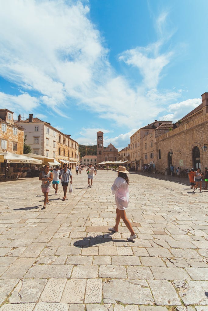 Vibrant summer day in the historic town square of Hvar, Croatia.
